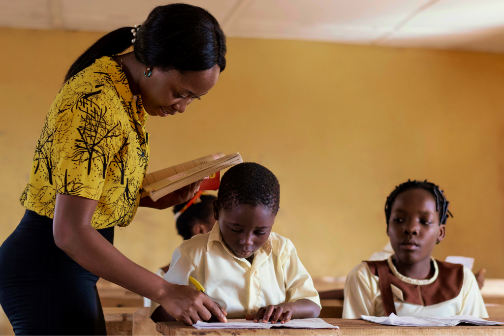 Teacher helping students with schoolwork